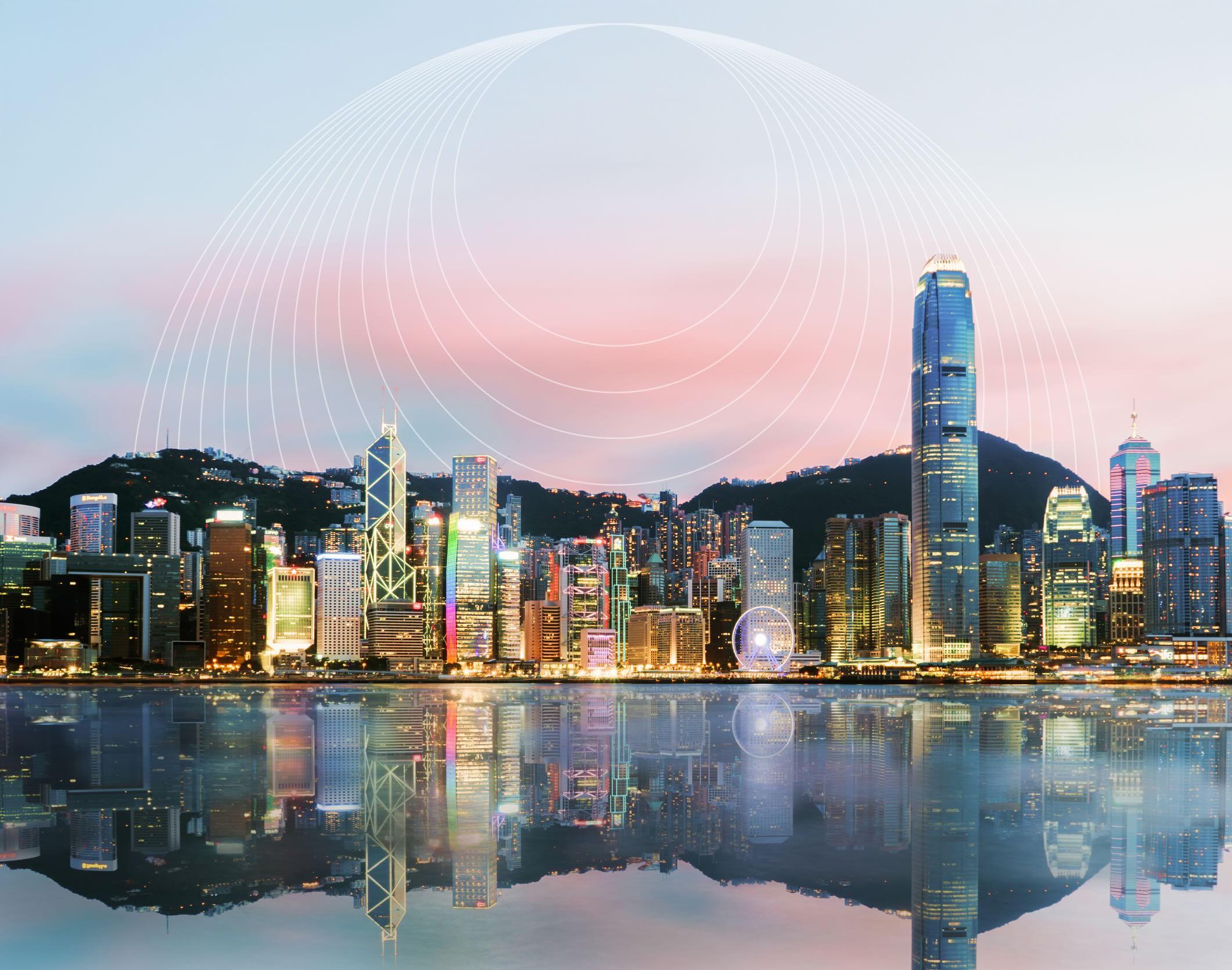 A city skyline at dusk with tall buildings, a mountain backdrop, and a reflective waterfront. Overhead, white concentric circles in the sky.